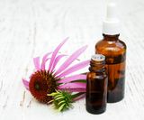 bottle-with-essence-oil-with-purple-echinacea_87742-7098
